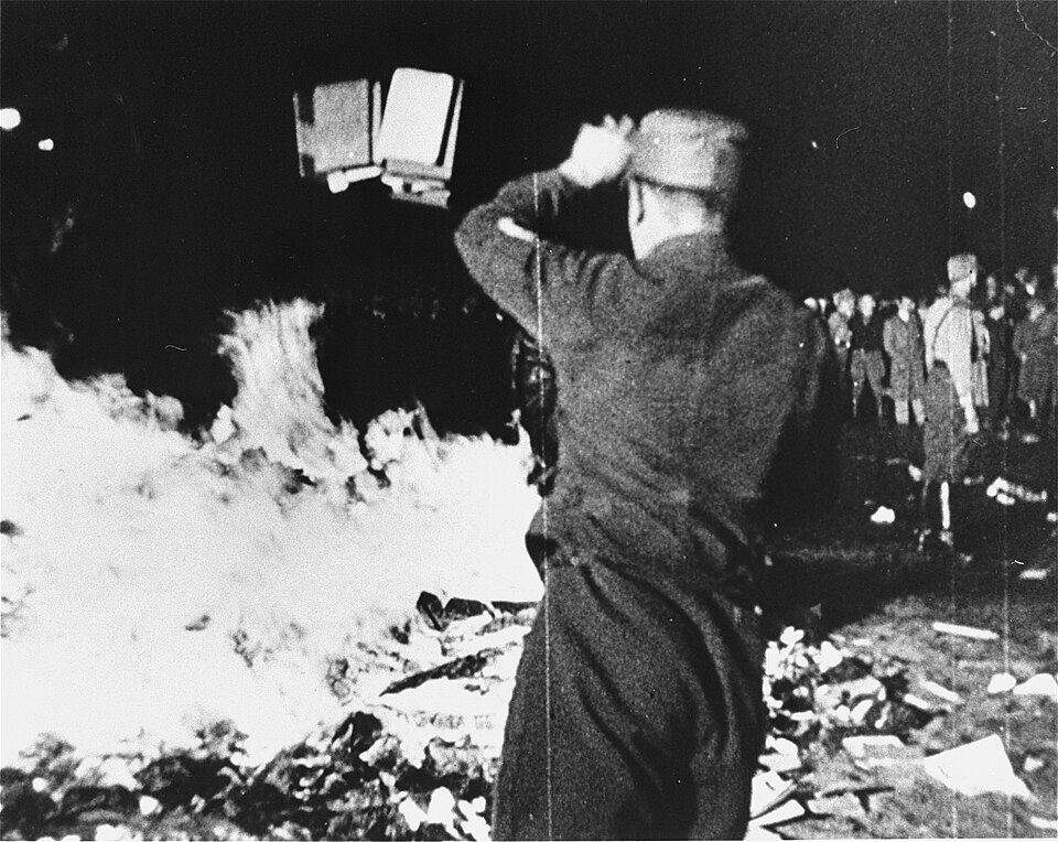 Nazi book burning in Berlin, May 10, 1933 - a crowd watches as books are thrown onto a massive bonfire